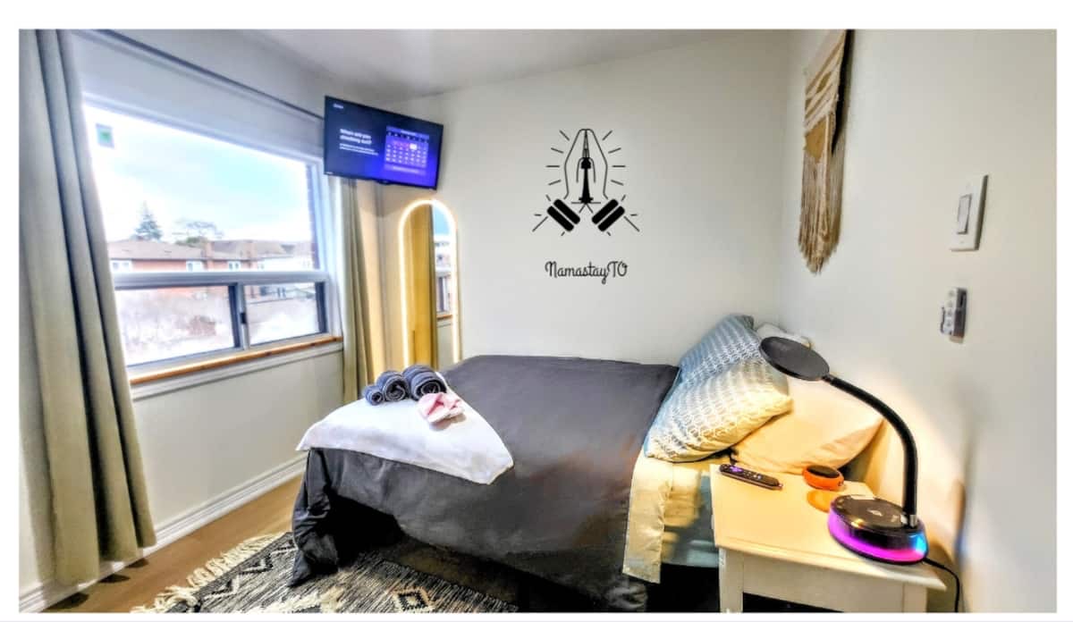 The East Room — boho room with LED mirror